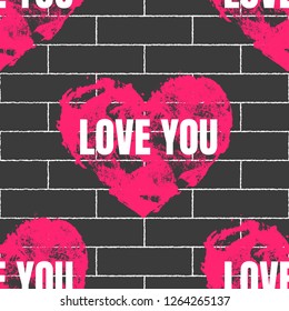 Vector seamless pattern with crimson shabby heart with white text Love You on the grey bricks wall.