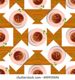 Vector seamless pattern. Cups of black, herbal tea with branch and tea leaves on plate, lay flat object on kitchen table with white tablecloth, wooden, timber background