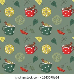Vector seamless pattern with cups of tea with spices and lemons. Fall wallpaper. Rowan and autumn leaves. Texture for textile or wrapping paper.