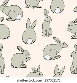 Vector seamless pattern with cute bunnies.