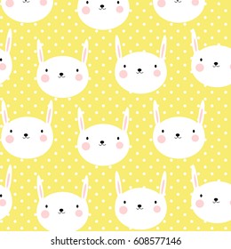 Vector seamless pattern with cute bunnies on yellow polka dot background. Design for fabric and decoration.