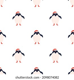 Vector seamless pattern with cute Christmas penguins in Santa hats