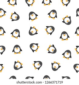 Vector seamless pattern with cute little penguins. Cartoon holiday background. Cute Xmas wrapping paper. Bright winter illustration.