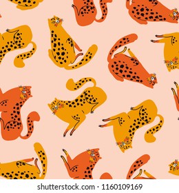 Vector seamless pattern with cute orange and red cheetahs on the pink background. Tropical animals. Fashionable fabric design for kids clothing.