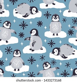 Vector seamless pattern with cute penguins and snowflakes. Winter repeated texture with cartoon characters. Childish print for kids fabric and wrapping paper. Scandinavian style. 