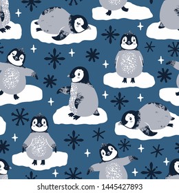 Vector seamless pattern with cute penguins and snowflakes. Winter repeated texture with cartoon characters. Childish print for kids fabric and wrapping paper. Scandinavian style. 