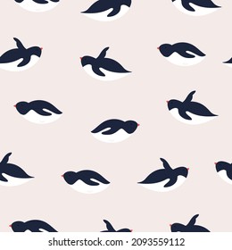 Vector seamless pattern with cute penguins. Funny antarctic animals.