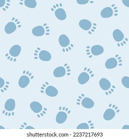 Vector seamless pattern with cute polar bear paw prints on snow