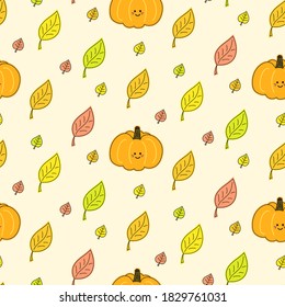 Vector seamless pattern with cute pumpkins and autumn leaves falling down