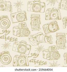 Vector seamless pattern with cute retro cameras.