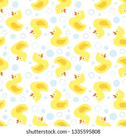 vector seamless pattern with cute rubber ducks and bubbles