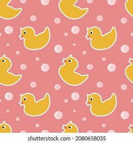 vector seamless pattern with cute rubber ducks and bubbles on a pink background. trend illustration in flat style