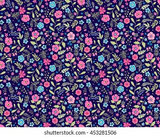 Vector seamless pattern. Cute pattern in small flower. Small pink flowers. Dark blue background. Ditsy floral background. The elegant the template for fashion prints.