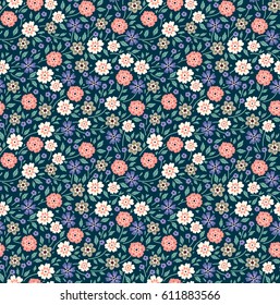 Vector seamless pattern. Cute pattern in small flower. Small multicolored flowers. Dark blue background. Ditsy floral background. The elegant the template for fashion prints.