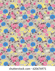 Vector seamless pattern. Cute pattern in small flower. Small multicolored flowers. 
Light background. Ditsy floral background. The elegant the template for fashion prints