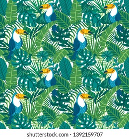 Vector seamless pattern with cute toucans and palm leaves. Repeated texture with birds in the rainforest. Colorful summer background with jungle parrots and plants.