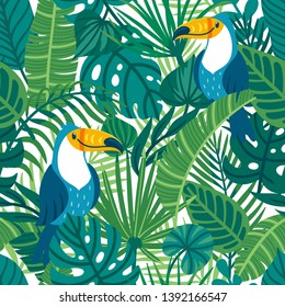 Vector seamless pattern with cute toucans and palm leaves. Repeated texture with birds in the rainforest. Colorful summer background with jungle parrots and plants.