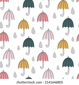 Vector seamless pattern with cute umbrellas and drops on a white background. Children's cute illustration. Ideal for clothing design, wrapping paper, wallpaper. A pattern with the sky.