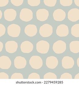 Vector seamless pattern with cutout circles. Hand drawn polka dot texture. Dotted background in retro style.