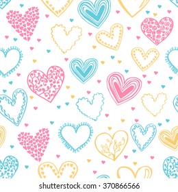 Vector seamless pattern in delicate pink, blue and yellow colors on white background. Beautiful hearts drawn in doodle style for your design.