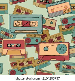 Vector seamless pattern with different cassettes. Retro style. Nostalgia for the 90s. Use for wrapping paper, fabric, textile, poster, banner. 