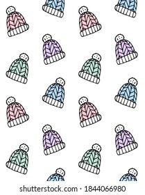 Vector seamless pattern of different hand drawn doodle sketch winter hat isolated on white background