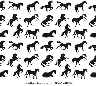 Vector seamless pattern of different hand drawn horse silhouette isolated on white background
