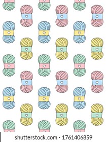 Vector seamless pattern of different pastel colored hand drawn doodle sketch knitting threads isolated on white background