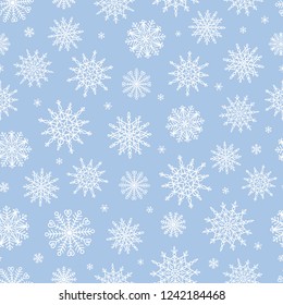 Vector seamless pattern with doodle snowflakes. Hand drawn winter background.