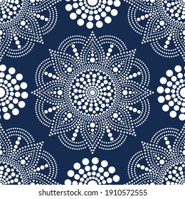 Vector seamless pattern with dot painting mandalas. Aboriginal style of dot painting. Decorative flower. Winter snowflake