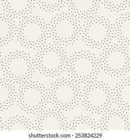 Vector seamless pattern with dotted circles. Stylish background with randomly disposed rings. Monochrome minimalist graphic design. Tileable simple texture from small black dots