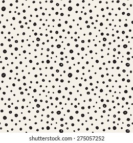 Vector seamless pattern with dotted circles. Stylish background with randomly disposed spots. Monochrome minimalist graphic design. Tileable simple texture from small black dots