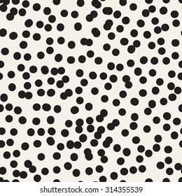 Vector seamless pattern with dotted circles. Stylish background with randomly disposed spots. Monochrome minimalist graphic design. Tileable simple texture from small black dots