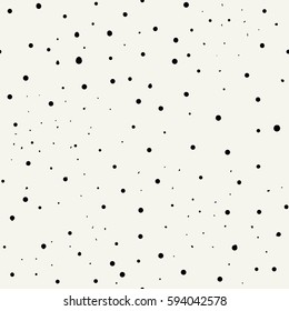 Vector seamless pattern with dotted circles. Stylish background with randomly disposed spots.  Tileable simple texture from small black dots