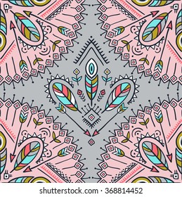 Vector seamless pattern with ethnic arrows, feathers and tribal ornaments. Boho and hippie stylish background. American indian motifs.