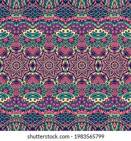 Vector seamless pattern. Ethnic boho geometric psychedelic colorful print with doodle graphic flowers and ornaments.