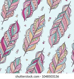 Vector seamless pattern with ethnic feathers. Colorful ethnic background.