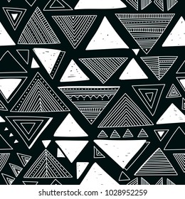 Vector seamless pattern with ethnic tribal boho trendy doodle triangle ornaments. Can be printed and used as wrapping paper, wallpaper, textile, fabric, etc.