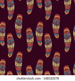 Vector seamless pattern with etno ornate colorful feathers. Illustration for you design.