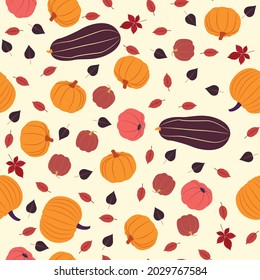 Vector seamless pattern of fall season. Flat design. Various pumpkins and colorful falling leaves on beige background