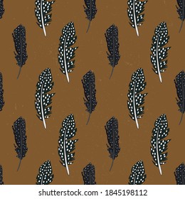 vector seamless pattern with feathers.