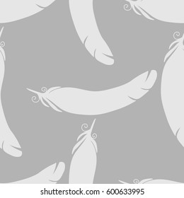 Vector seamless pattern with feathers on a gray background