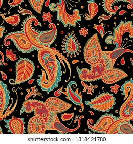 Vector seamless pattern. Firebirds and floral elements in Paisley style. 