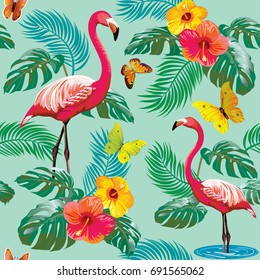 Vector seamless pattern with flamingos and tropical plants