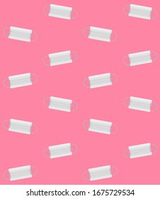 Vector seamless pattern of flat cartoon medical face mask isolated on pink background 