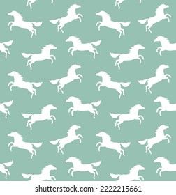 Vector seamless pattern of flat horse silhouette isolated on mint background