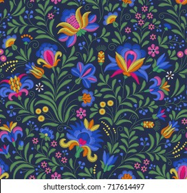 Vector seamless pattern. Floral background in vintage style. Decorative embroidery flowers. Ornament for textiles on blue background. Colorful flowers. The elegant the template for fashion prints.