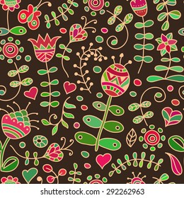 Vector seamless pattern with floral doodling design. Hand drawn flowers and branches. Cute background in primitive ethnic style. Bright colors on a dark brown background