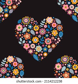 Vector seamless pattern with floral heart. Hand drawn heart with flowers, leaves, dots and berries. Cute retro colors. Colorful heart on a black background.