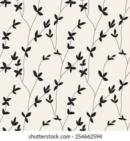 Vector seamless pattern. Floral stylish background. Silhouette of branches with leaves